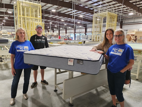 Compass Mattress Donation. From l-r: Berneice Cox, president and CEO, United Way of the Big Bend; Clint Glazener, production manager, Compass Sleep Products; Savannah Vause, director of human resources, Compass; and Rhonda Cooper, vice president of community impact, United Way of the Big Bend.