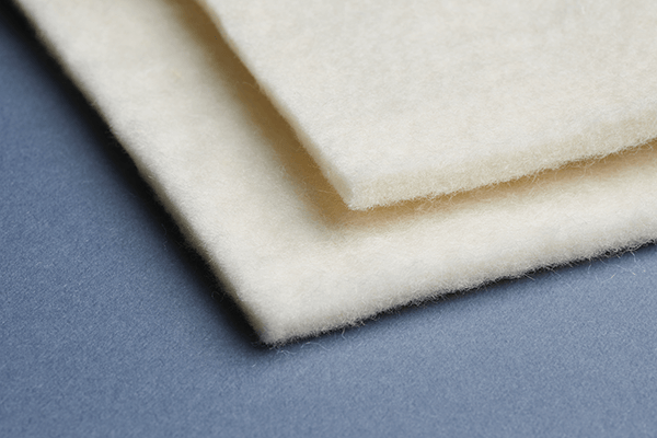 A recent addition to the John Marshall line, Joma Memory Wool is a
needle-punch product used right below wool batting to provide a natural FR barrier in the top layer of a mattress. John Marshall also promotes this as “memory wool” because it can easily replace a foam layer.